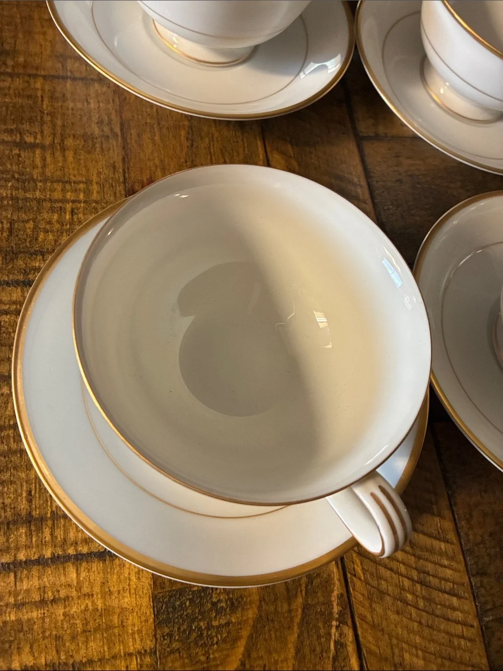 Noritake White Porcelain Teacup and Saucer Set with Gold Trim